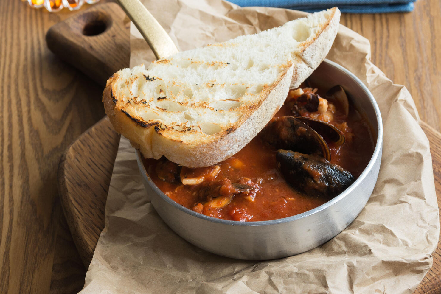 Delicious hearty lunch at a fish restaurant. Tuscan tomato soup with seafood Cacciucca.