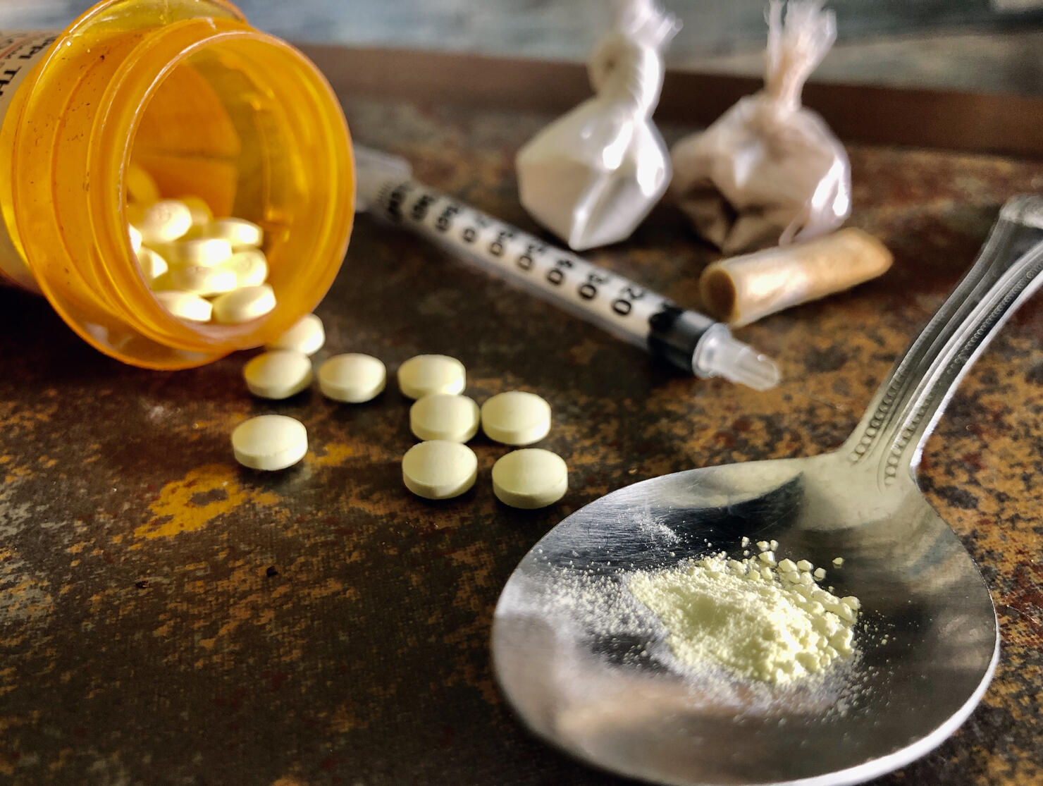 Narcotic opiate drugs, heroin, and cocaine with syringe and spoon