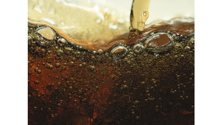 Close up soda pour