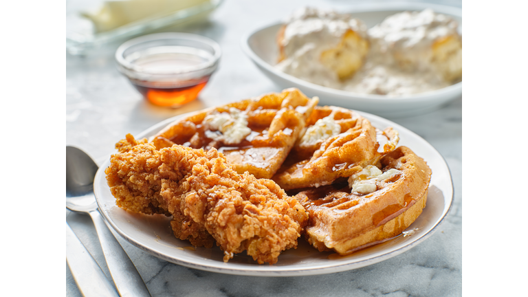 fried chicken and waffles breakfast with syrup