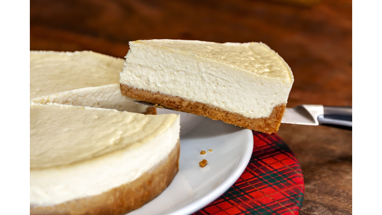 Cheesecake slice on a knife