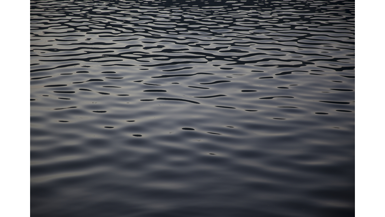 Reflection in london canal at dusk looking like oil