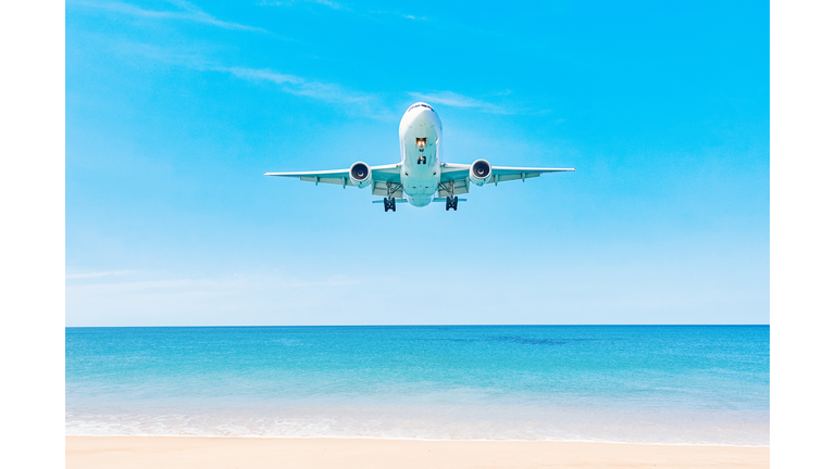 Plane is landing over water