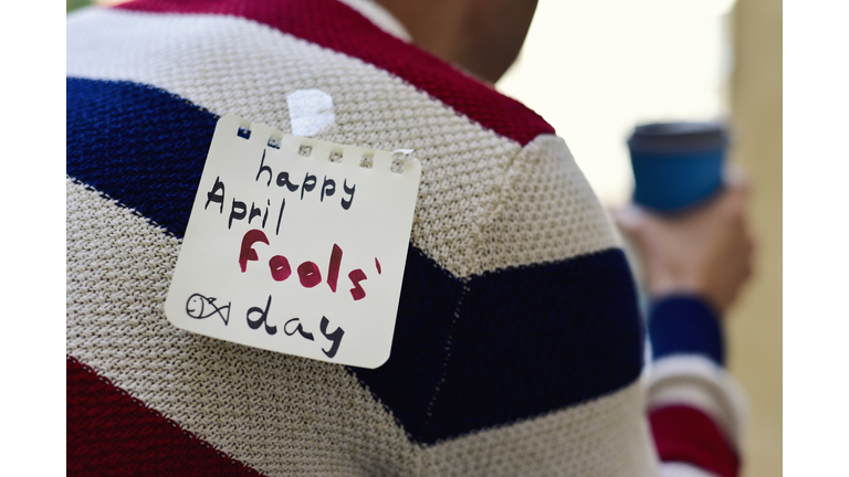 young man and text happy april fools day