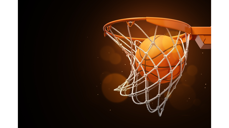 3d rendering of a basketball in the net on a dark background.