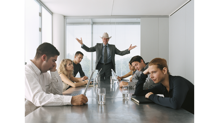 Businessman Talking to Bored Staff in Meeting