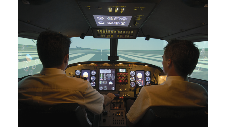 Pilots taxing on airport runway