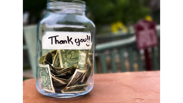 glass tip jar at checkout counter