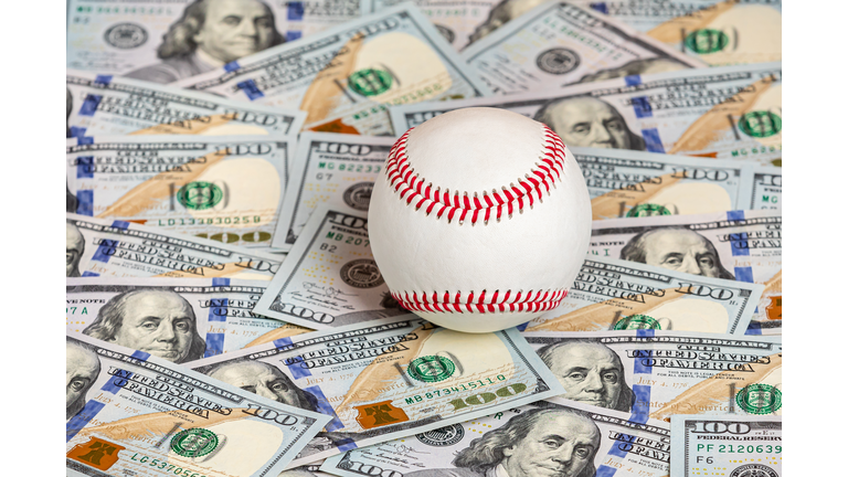 Baseball with cash money. Major league strike, lockout and sports betting concept.