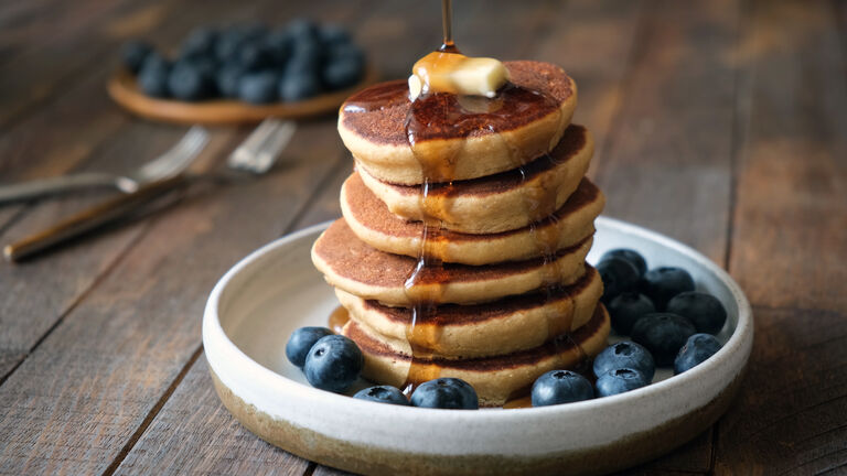 Buckwheat pancakes with syrup and blueberries