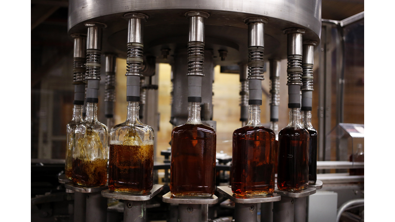 Bottles of single barrel bourbon are filled on the bottling line at a distillery