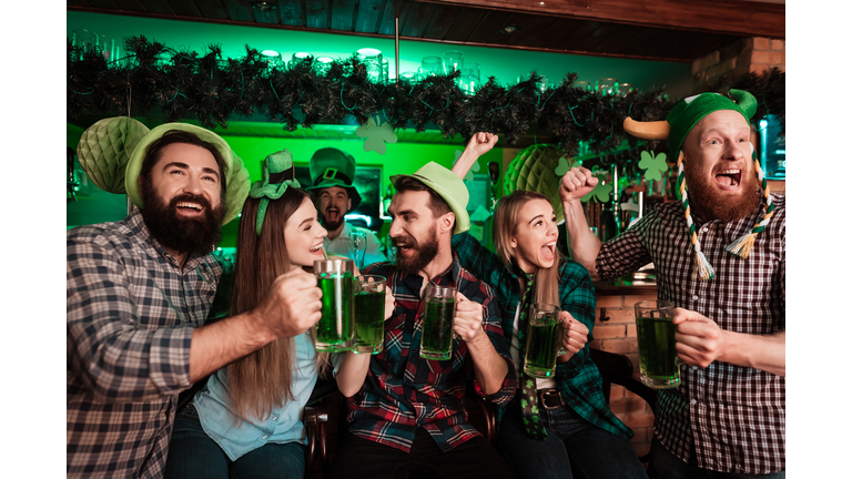 The company of young people celebrate St. Patrick's Day.