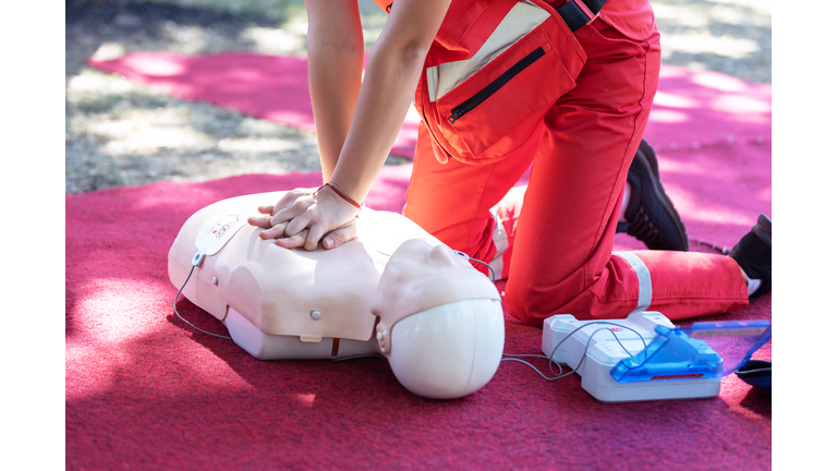 Hands Of A Paramedic Doing Chest Compression During Defibrillator Cpr Training