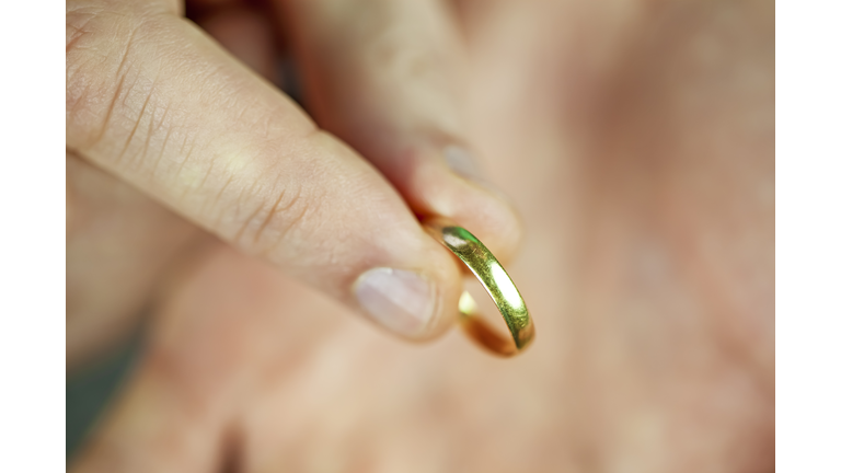 A man holding old wedding ring