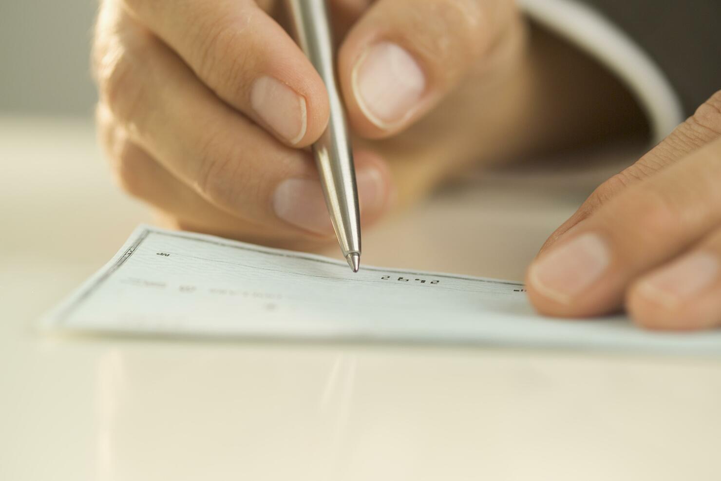 Man writing out a check