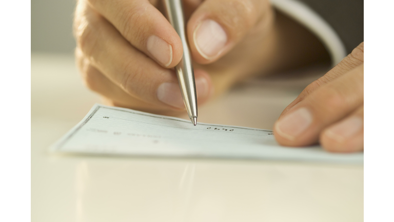 Man writing out a check