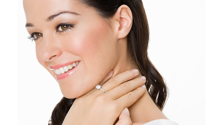 Smiling woman wearing an engagement ring