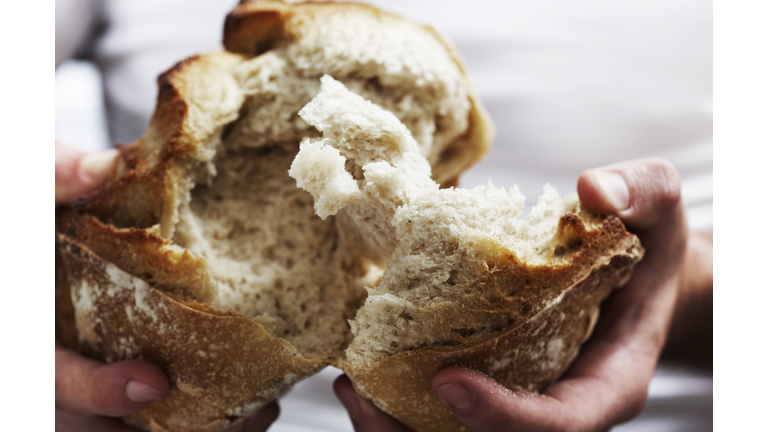 Man breaking bread 