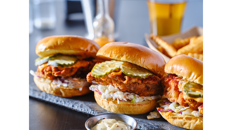 spicy nashville hot chicken sandwich with coleslaw and pickles