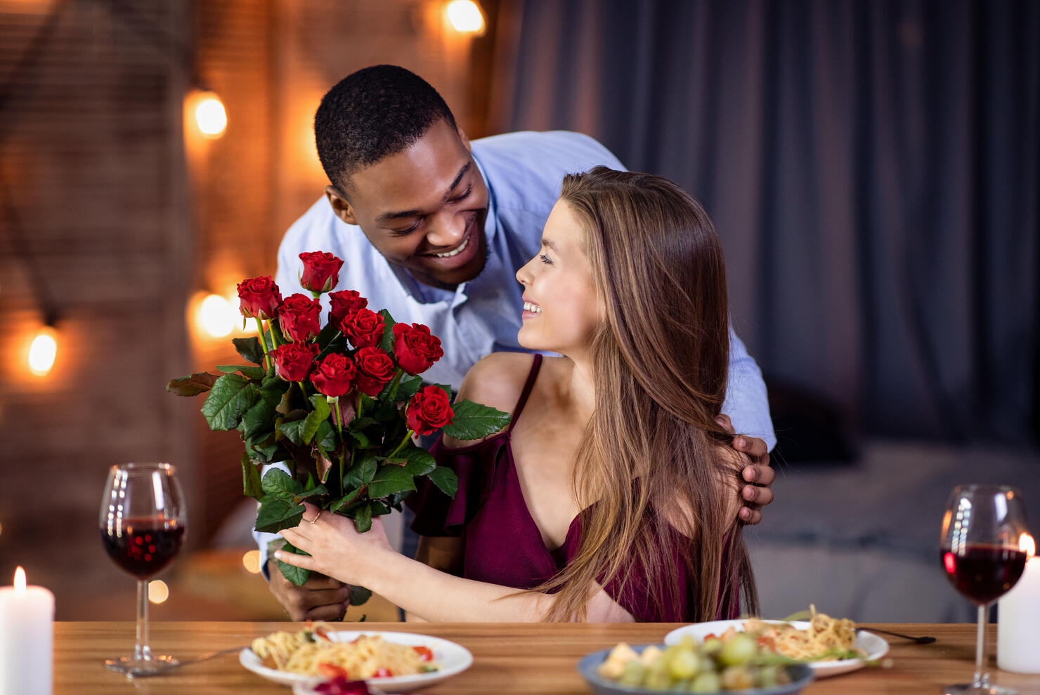 Loving African American Guy Surprising His Beautiful Girlfriend With Roses Bouquet