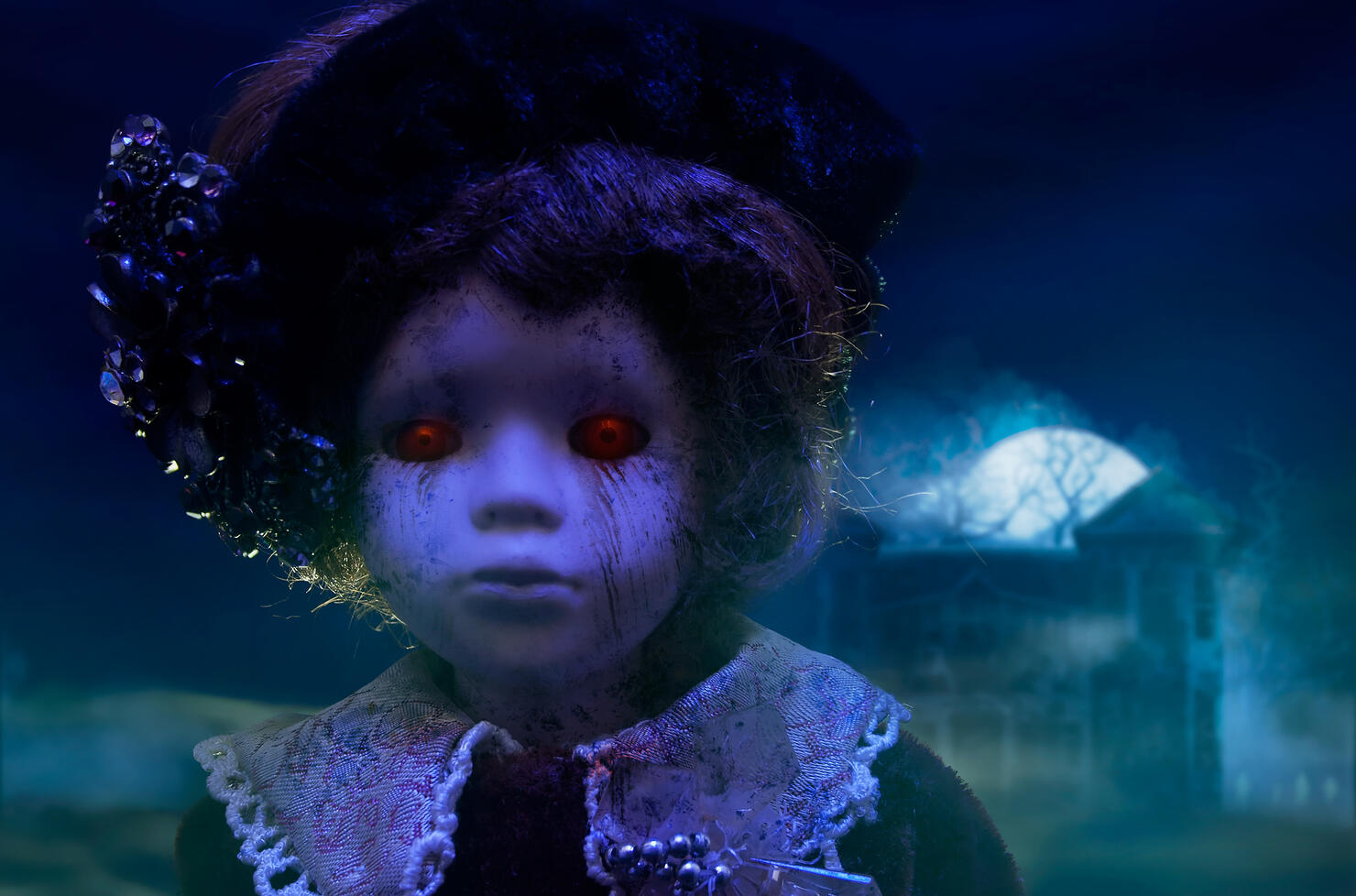 Horror doll with haunted house.