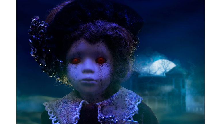 Horror doll with haunted house.
