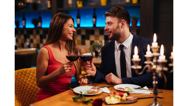 Couple enjoying red wine on Valentine's Day