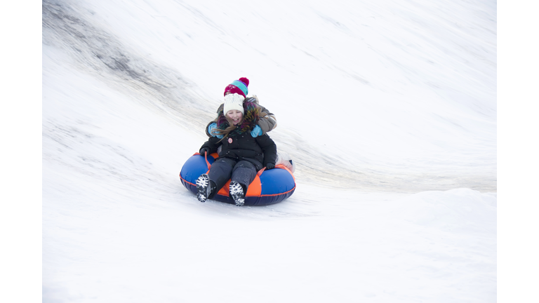 Child sledding tubing.