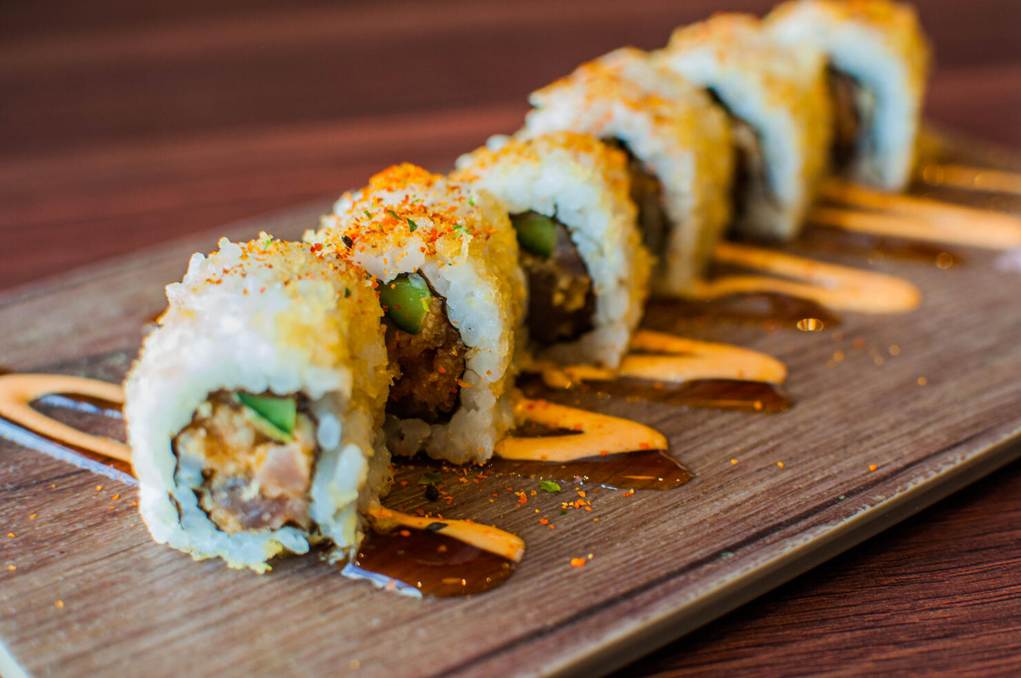 A high-angle and close-up view of freshly made tuna sushi