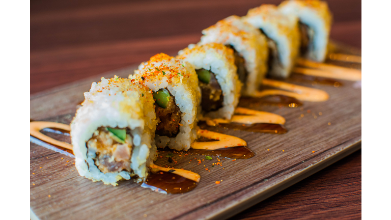A high-angle and close-up view of freshly made tuna sushi