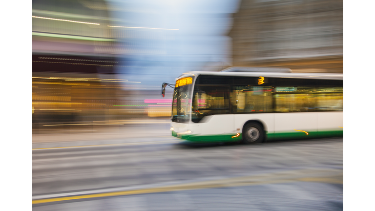 Bus driving on city street