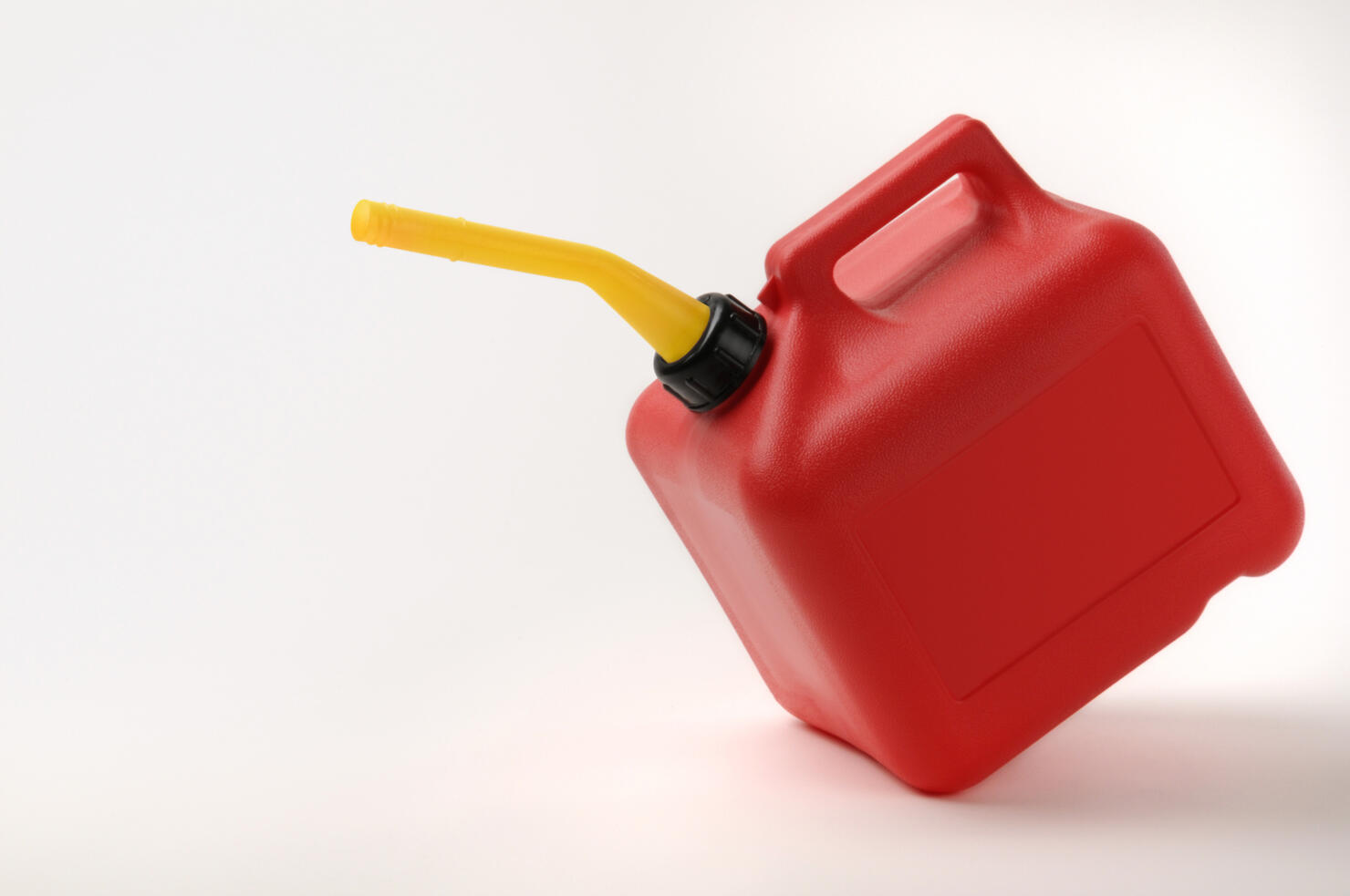 Red and Yellow Gas Can Tipping With Clipping Path