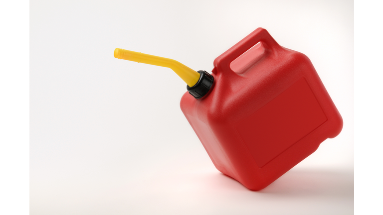 Red and Yellow Gas Can Tipping With Clipping Path