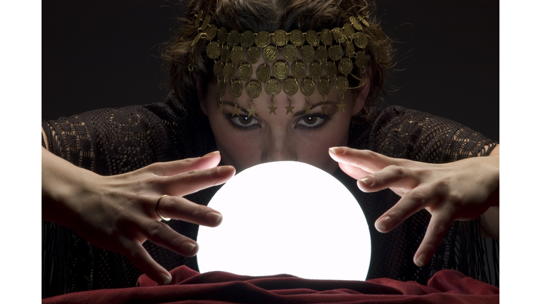 fortune teller with glowing crystal ball