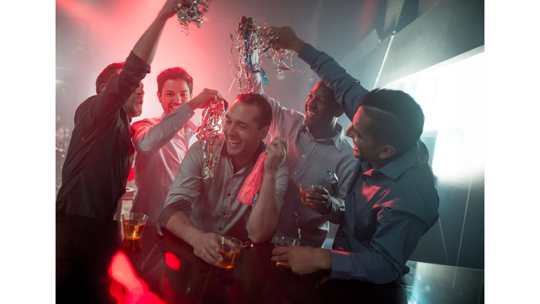 Happy group of men at a bachelor party