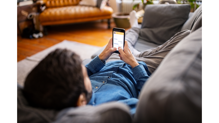 Man chatting with friend on messaging app