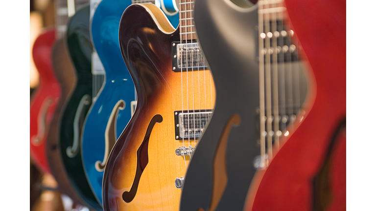 Guitars Hanging in a Store