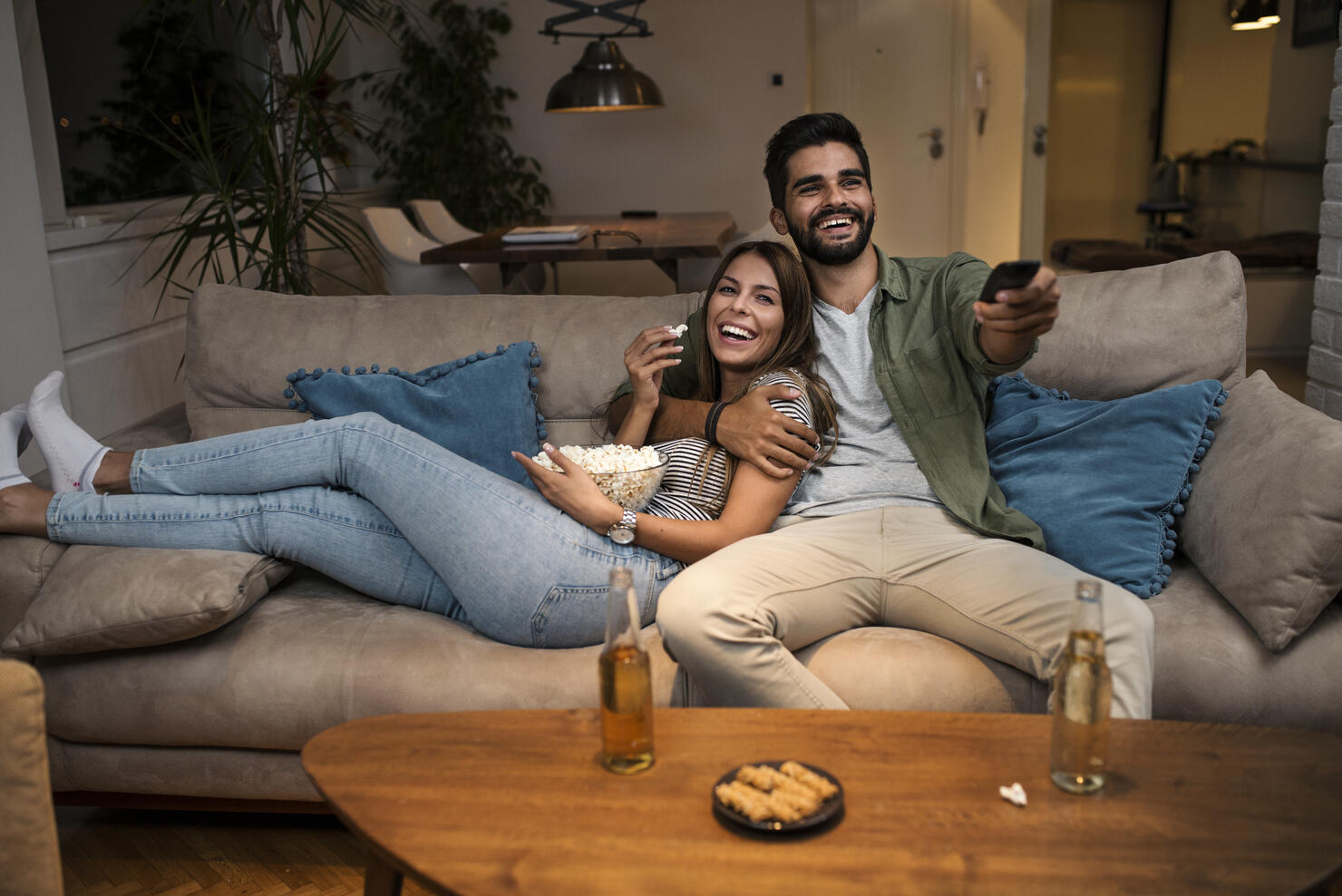 Couple on Sofa Watching TV