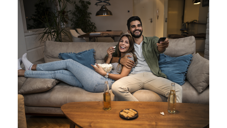 Couple on Sofa Watching TV