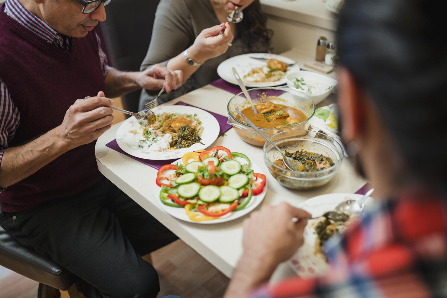 Family Eating Indian food Together