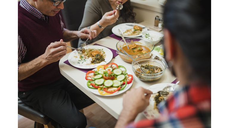 Family Eating Indian food Together