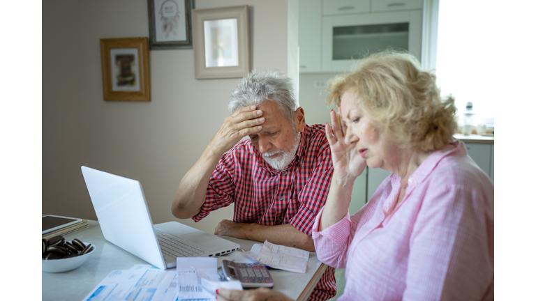 Spouses manage family budget check bills cheques