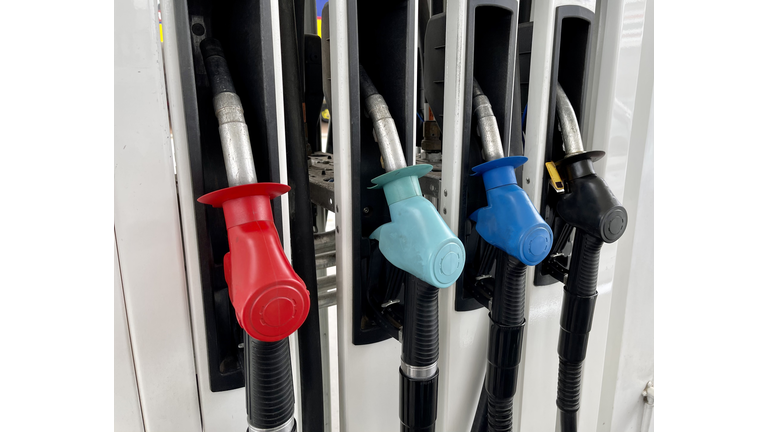 Coloured fuel pumps at a gas station
