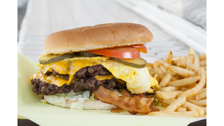 Double cheeseburger with egg, bacon & french fries