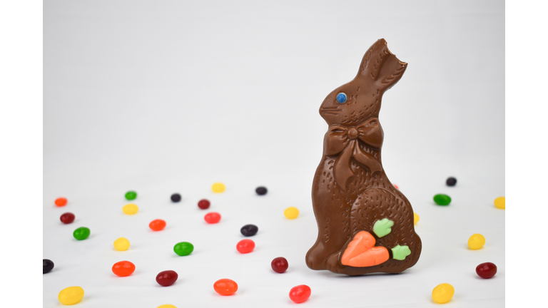 Chocolate Easter Bunny and Jelly Beans Candy on White Background