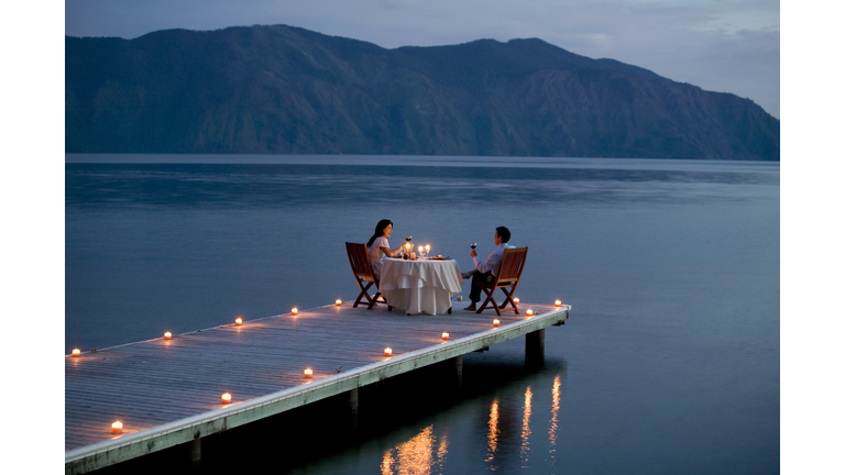 Couple Having Romantic Dinner Date on Pier