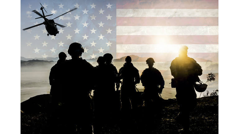 Silhouettes of soldiers during Military Mission against American flag background