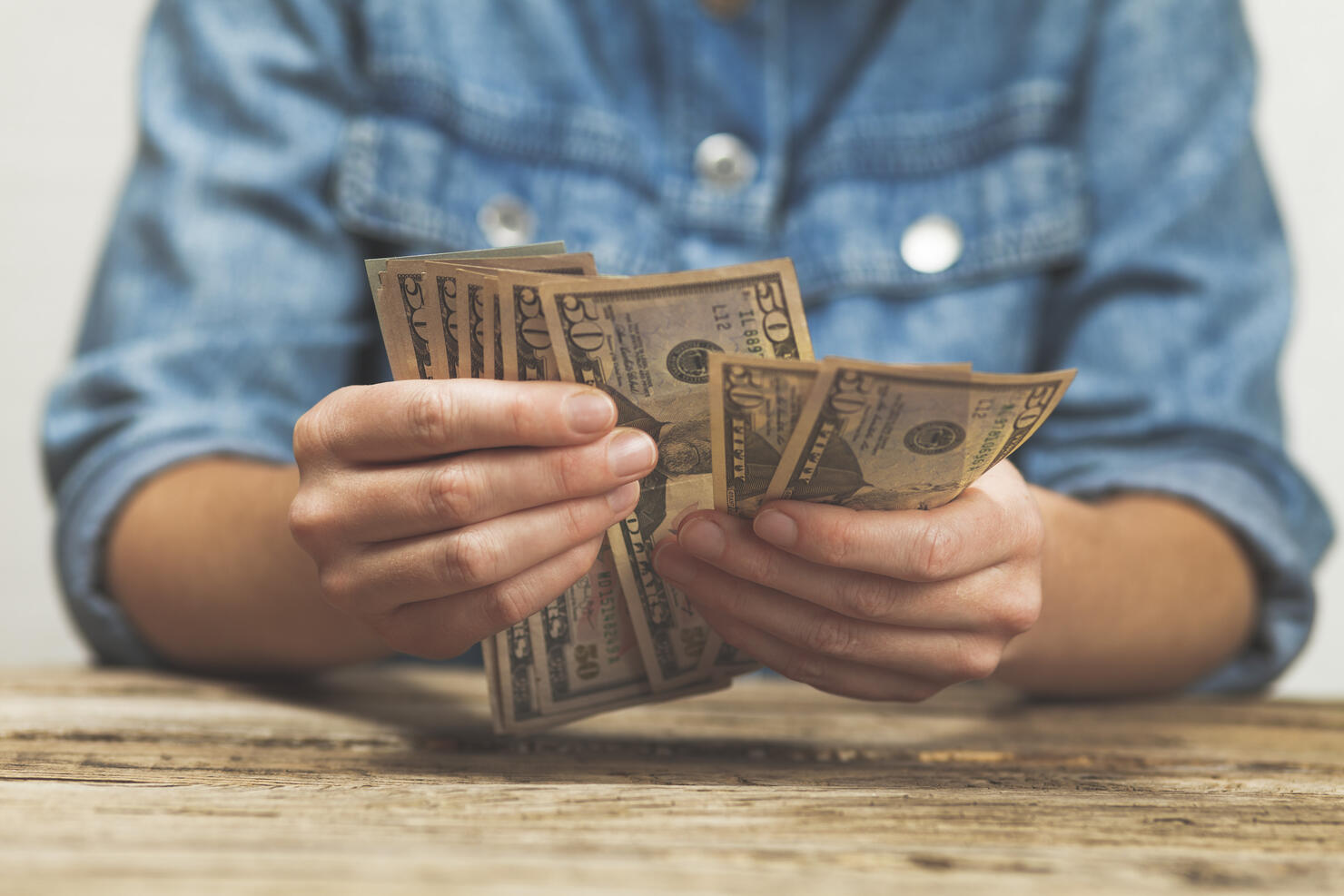 Dollars in hand, small salary. Winning the lottery