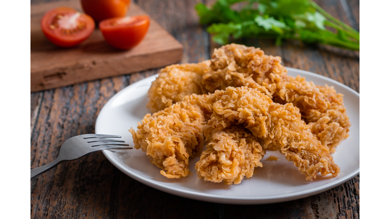 Crispy fried breaded chicken strips on plate