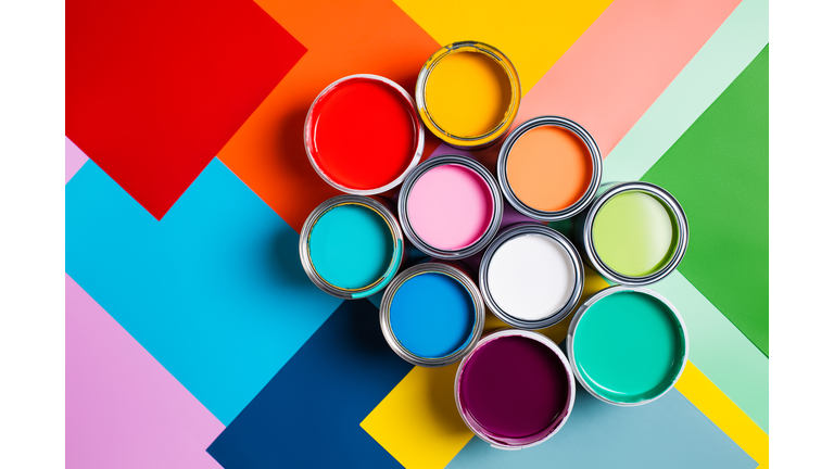 Various bright paints on colorful background